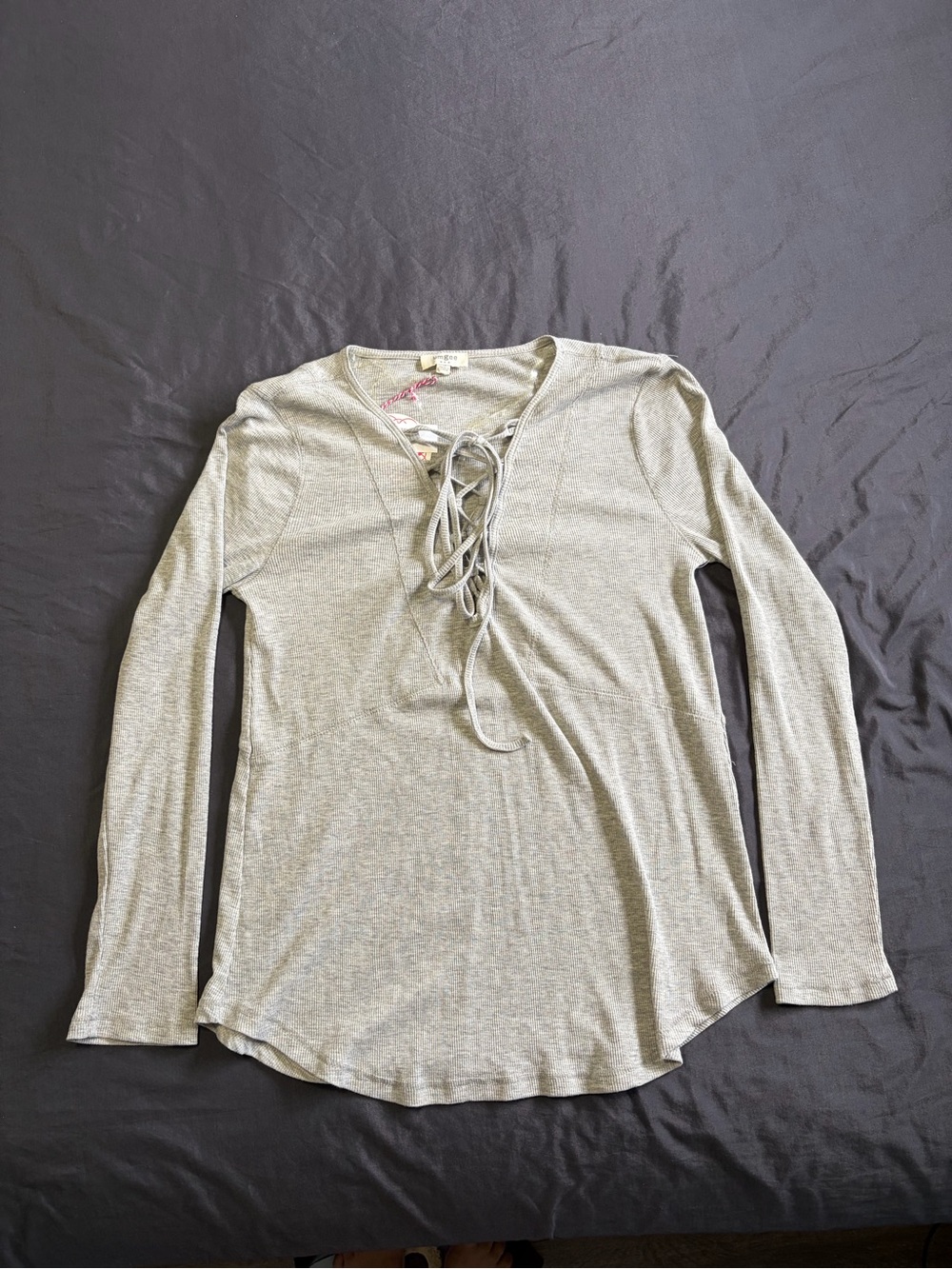 Umgee light grey flowy long sleeve top with lace up detail. Size: M
